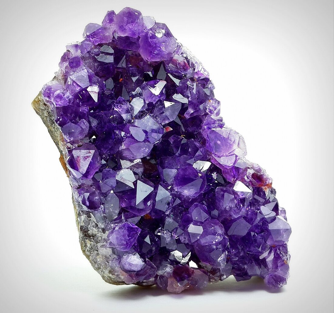 Amethyst specimen — deep violet quartz, colour saturating toward the terminations