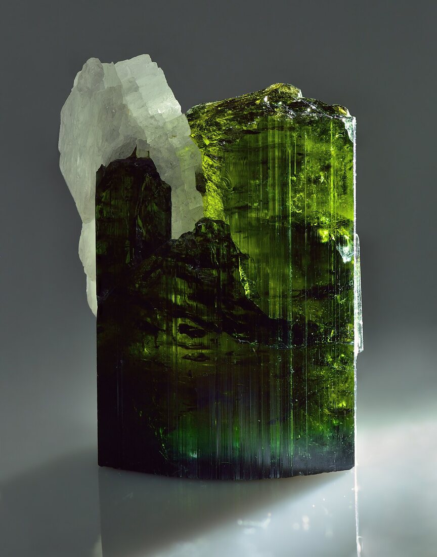 Tourmaline specimen — colour-zoned prism with striated faces